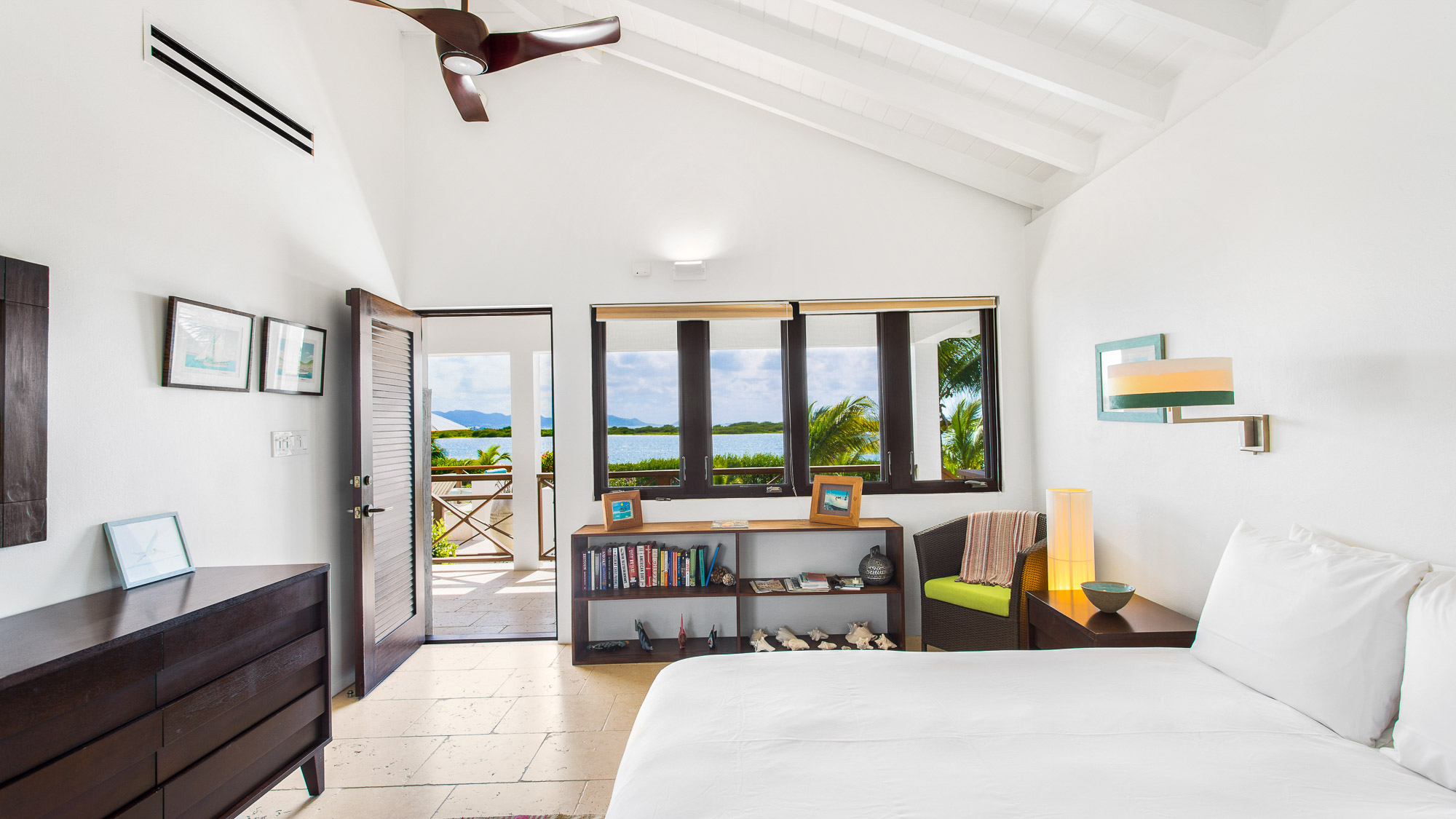 Bedroom with vaulted white ceiling